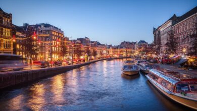 canal boats buildings reflection 5488271